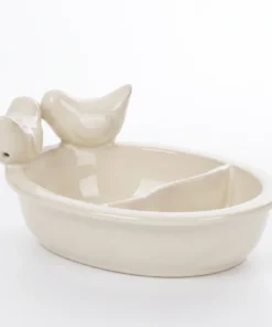 Witte keramieken drinkschaal met twee vakken, close-up